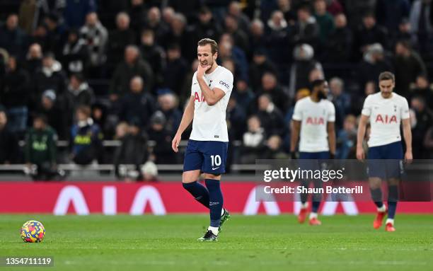 Harry Kane of Tottenham Hotspur looks dejected after their side concedes a first goal scored by Daniel James of Leeds United during the Premier...