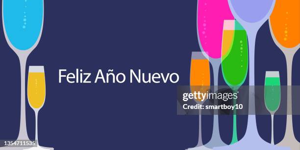 feliz ano nuevo. spanish happy new year, spanish culture, spanish language, feliz año nuevo - nuevo stock illustrations