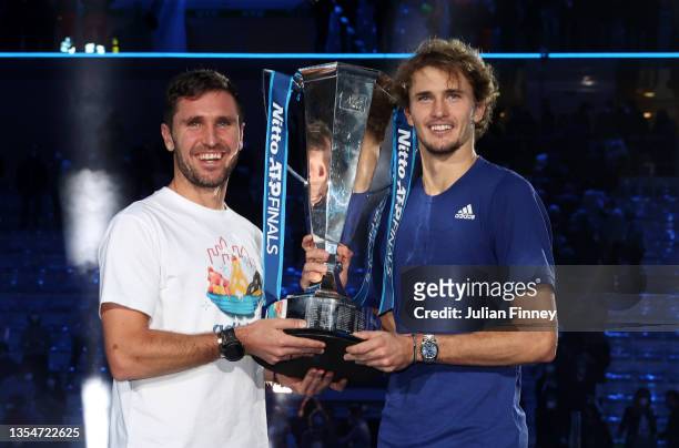 Alexander Zverev of Germany and Mischa Zverev, Brother and Coach pose with the trophy after the Men's Single's Final between Alexander Zverev of...