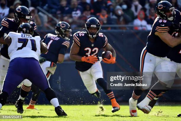 David Montgomery of the Chicago Bears runs the ball in the game against the Baltimore Ravens during the first quarter at Soldier Field on November...