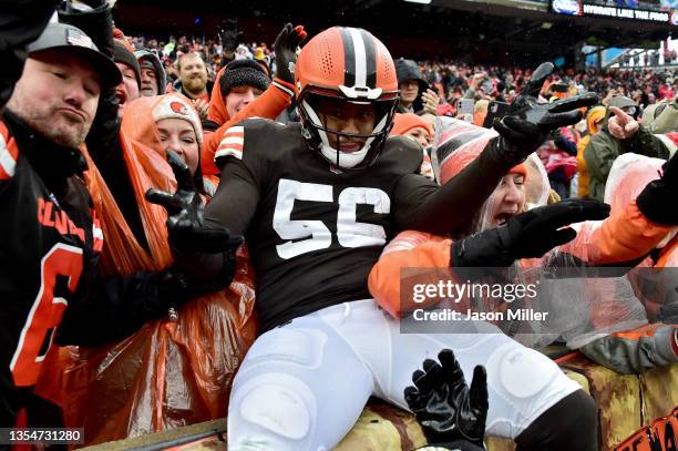 Malcolm Smith of the Cleveland Browns celebrates with fans after an interception in the first quarter against the Detroit Lions at FirstEnergy...