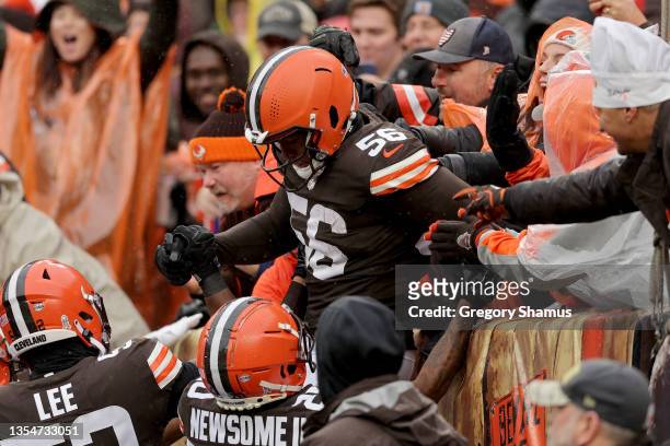Malcolm Smith of the Cleveland Browns celebrates with fans after an interception in the first quarter against the Detroit Lions at FirstEnergy...