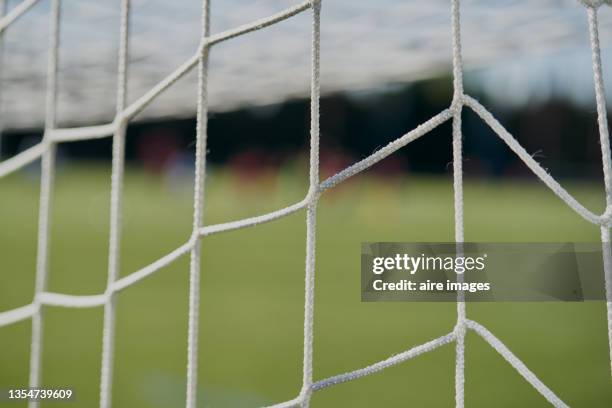 closeup shot of a football goal white net - soccer goal post stock pictures, royalty-free photos & images