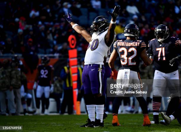 Justin Houston of the Baltimore Ravens reacts after a play in the game against the Chicago Bears during the third quarter at Soldier Field on...