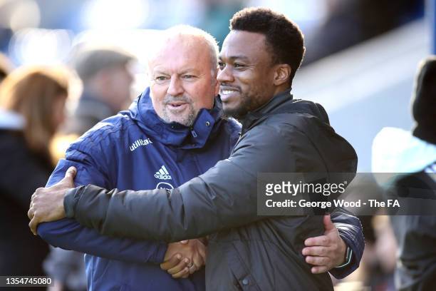 Assistant Referee, Adewunmi Soneye interacts with Neil Redfearn, Manager of Sheffield United prior to the Barclays FA Women's Championship match...
