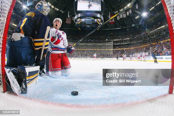 Ryan Callahan of the New York Rangers falls to his knees while celebrating his second period goal against Jhonas Enroth of the Buffalo Sabres at...