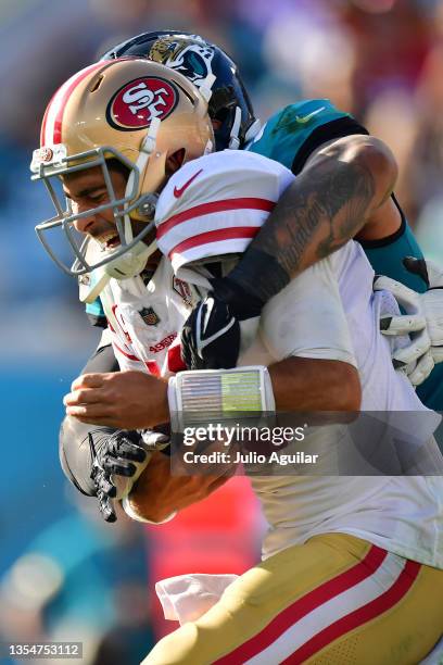 Jimmy Garoppolo of the San Francisco 49ers is sacked during the fourth quarter against the Jacksonville Jaguars at TIAA Bank Field on November 21,...