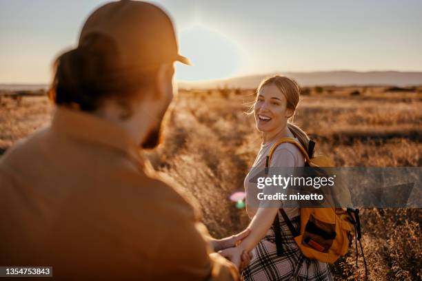 follow me - young couple holding hands stock pictures, royalty-free photos & images