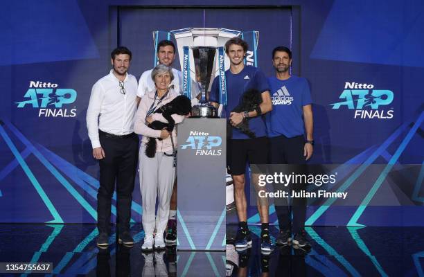 Alexander Zverev of Germany, Mischa Zverev, Brother and Coach along with his mother and dogs pose with the trophy after the Men's Single's Final...