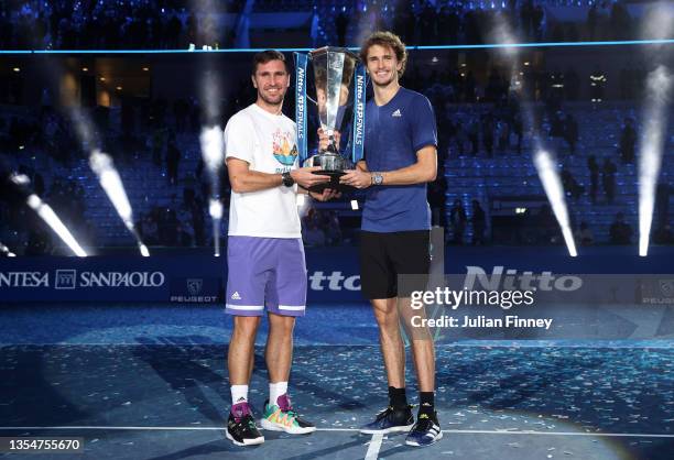 Alexander Zverev of Germany with Mischa Zverev, Brother and Coach with the trophy after the Men's Single's Final between Alexander Zverev of Germany...