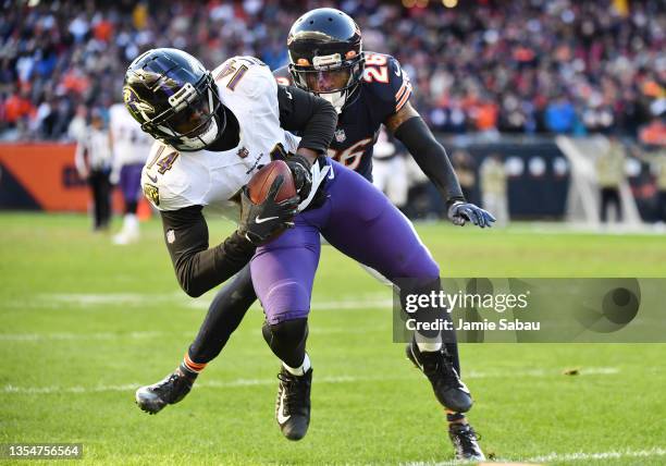 Sammy Watkins of the Baltimore Ravens is tackled by Deon Bush of the Chicago Bears during the fourth quarter at Soldier Field on November 21, 2021 in...