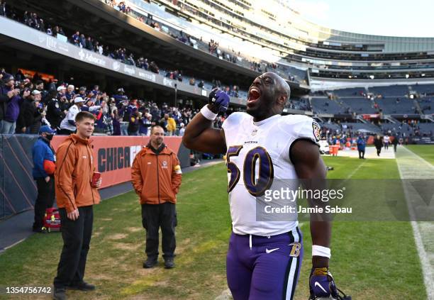 Justin Houston of the Baltimore Ravens celebrates a win over the Chicago Bears while walking off the field at Soldier Field on November 21, 2021 in...
