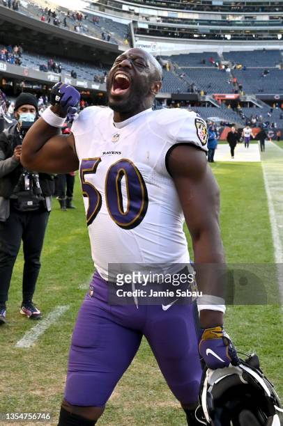 Justin Houston of the Baltimore Ravens celebrates a win over the Chicago Bears while walking off the field at Soldier Field on November 21, 2021 in...