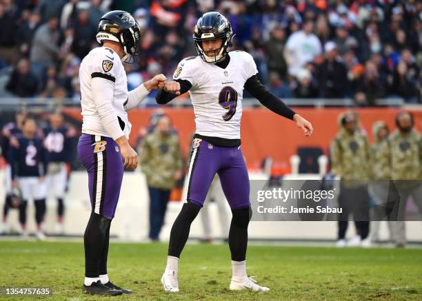 Justin Tucker and Sam Koch of the Baltimore Ravens celebrates a field goal in the game against the Chicago Bears during the fourth quarter at Soldier...