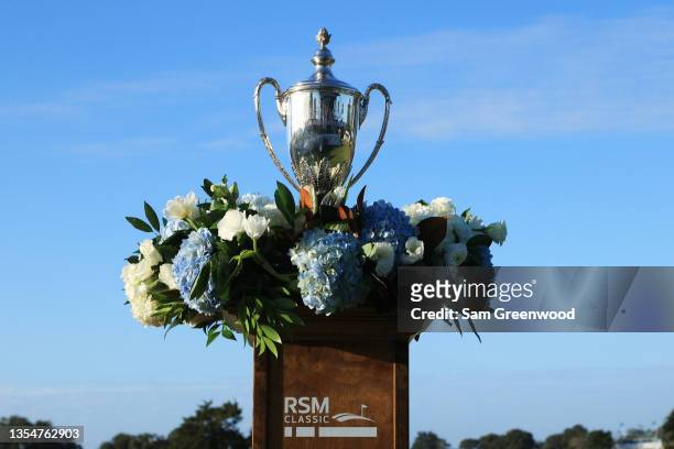 The trophy is displayed on the 18th green during the final round of The RSM Classic on the Seaside Course at Sea Island Resort on November 21, 2021...