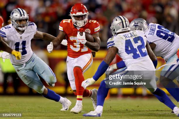 Darrel Williams of the Kansas City Chiefs runs withe the ball against the Dallas Cowboys defense in the fourth quarter of the game at Arrowhead...
