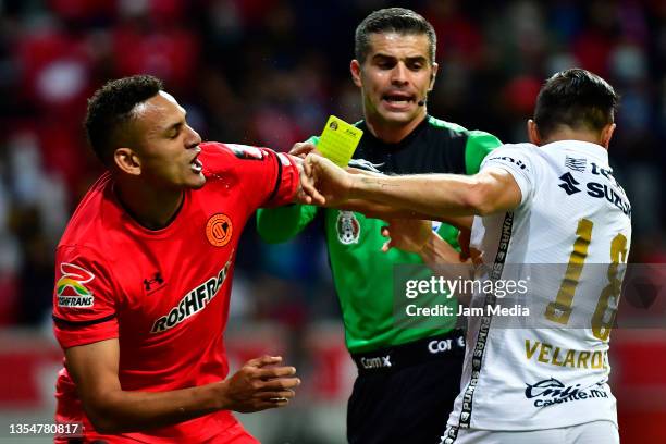 Oscar Vanegas of Toluca and Efrain Velarde of Pumas fight during the repechage match between Toluca and Pumas UNAM as part of the Torneo Grita Mexico...