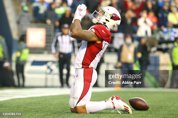 James Conner of the Arizona Cardinals celebrates his fourth quarter touchdown against the Seattle Seahawks at Lumen Field on November 21, 2021 in...