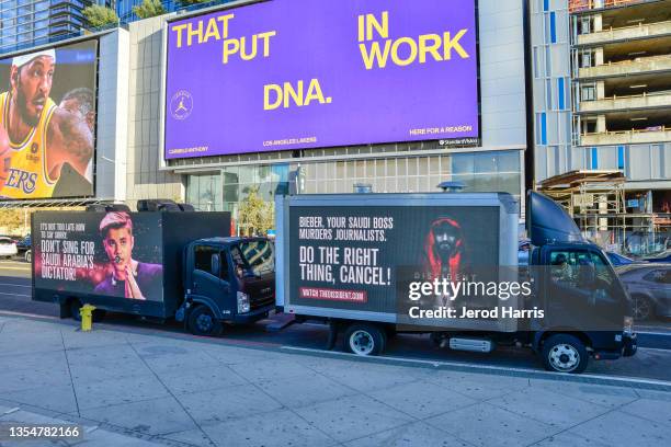 Mobile billboards urging Justin Bieber to cancel his upcoming concert in Saudi Arabia near the Microsoft Theater on November 21, 2021 in Los Angeles,...