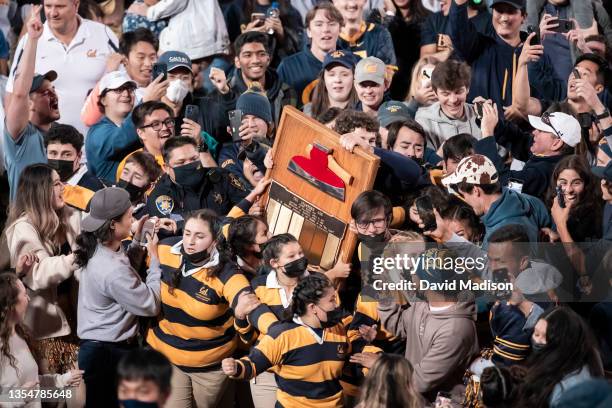 The Stanford Axe is carried on the field at Stanford Stadium by University of California Axe Committee members and spectators following the...