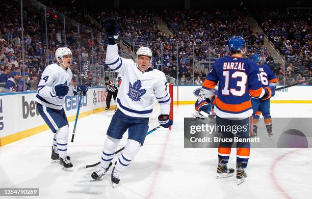 Ondrej Kase of the Toronto Maple Leafs celebrates his third period goal against the New York Islanders at the UBS Arena on November 21, 2021 in...