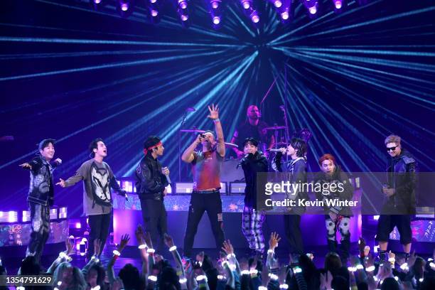 Chris Martin of Coldplay and J-Hope, Jin, V, Jungkook, Jimin, Suga, and RM of BTS perform onstage during the 2021 American Music Awards at Microsoft...