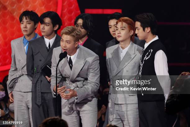 Hope, V, RM, Jimin, Suga, and Jungkook of BTS accept the Artist of the Year award onstage during the 2021 American Music Awards at Microsoft Theater...