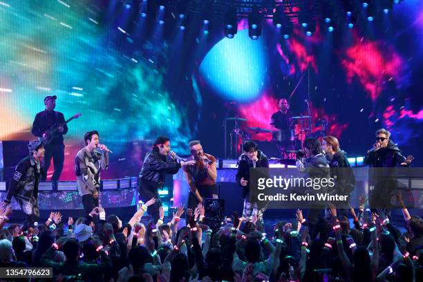 Chris Martin of Coldplay and J-Hope, Jin, V, Jungkook, Jimin, Suga, and RM of BTS perform onstage during the 2021 American Music Awards at Microsoft...