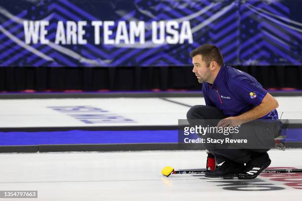 John Landsteiner of the United States watches action after delivering a stone during Game 3 of the US Olympic Team Trials at Baxter Arena on November...