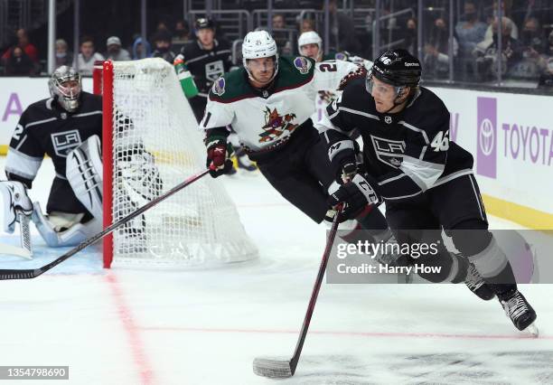 Blake Lizotte of the Los Angeles Kings carries the puck as he is chased by Loui Eriksson of the Arizona Coyotes during the first period at Staples...