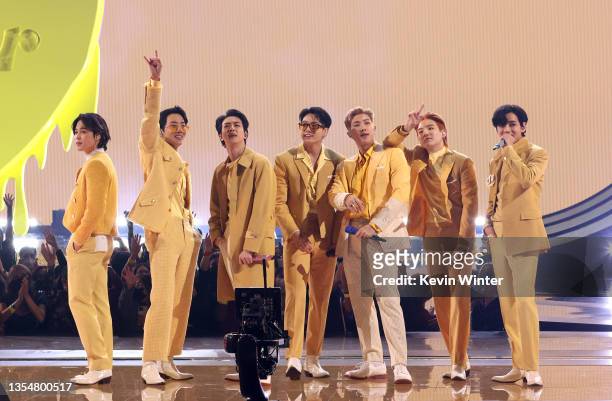 Jimin, J-Hope, Jin, Jungkook, RM, Suga, and V of BTS perform onstage during the 2021 American Music Awards at Microsoft Theater on November 21, 2021...