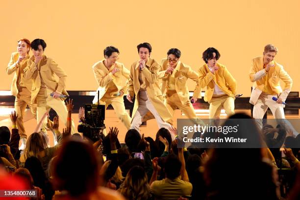 Suga, V, J-Hope, Jin, Jungkook, Jimin, and RM of BTS perform onstage during the 2021 American Music Awards at Microsoft Theater on November 21, 2021...