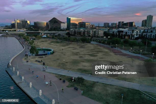 In an aerial view, athletes run through Tempe Town Lake during the SelectBlinds Ironman Arizona on November 21, 2021 in Tempe, Arizona.