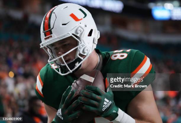 Will Mallory of the Miami Hurricanes catches a pass for a touchdown against the Virginia Tech Hokies during the first half at Hard Rock Stadium on...