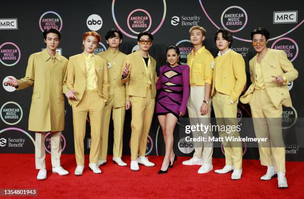 Becky G poses with Jin, Suga, V, Jungkook, RM, Jimin, and J-Hope of BTS in the press room during the 2021 American Music Awards at Microsoft Theater...