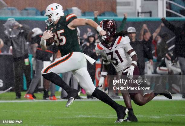 Will Mallory of the Miami Hurricanes makes a catch for a touchdown against the Virginia Tech Hokies at Hard Rock Stadium on November 20, 2021 in...