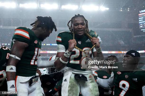 Marcus Clarke of the Miami Hurricanes celebrates with the turnover chain after recovering a fumble against the Virginia Tech Hokies at Hard Rock...