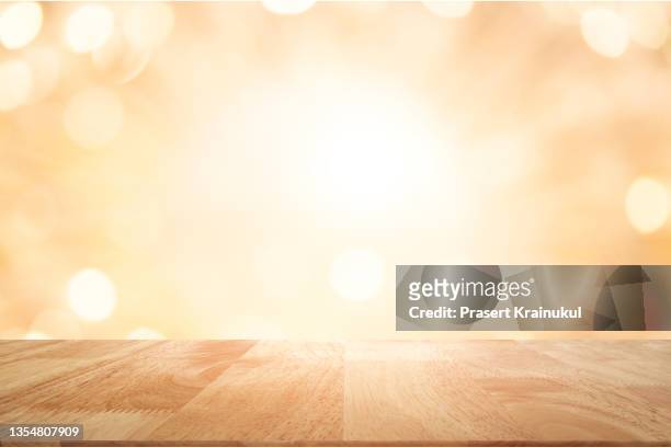 empty wood table top, counter, desk background - gold bars stock-fotos und bilder
