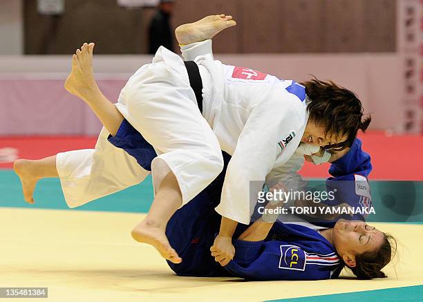 Marie Pasquet of France fights with Tomoe Ueno of Japan during the women's 70kg class elimination round match in the Judo Grand Slam tournament in...