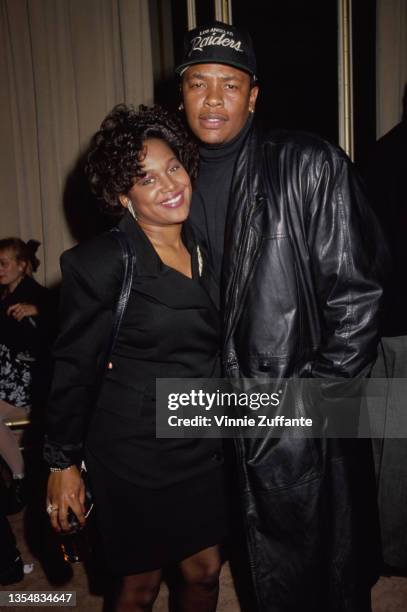 American R&B singer Michel'le , wearing a black outfit, with American rapper and record producer Dr Dre, wearing a black leather jacket and a Los...