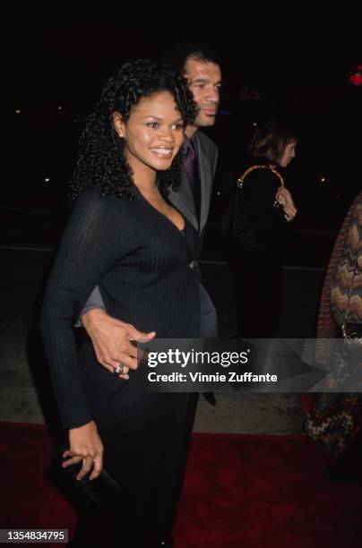 American actress Kimberly Elise and her husband, American photographer Maurice Oldham , attend the Westwood premiere of 'Beloved' held at the Mann...