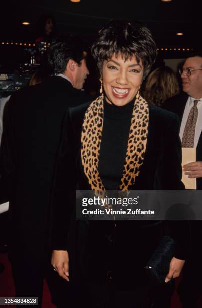 American journalist and newsreader Arthel Neville, wearing a black jacket with a leopard skin collar, attends the Westwood premiere of 'Disclosure',...