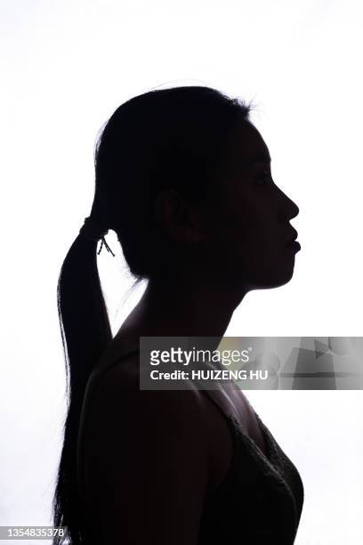 portrait of a young woman side view - profile woman silhouette imagens e fotografias de stock