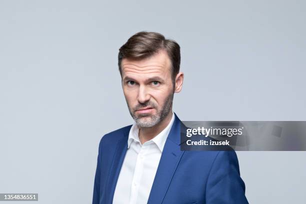 headshot of confused mature businessman - annoyed face brunnette stock pictures, royalty-free photos & images