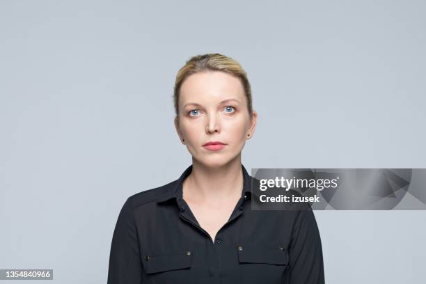 headshot of confident businesswoman - blank expression stock pictures, royalty-free photos & images