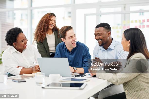 shot of a group of businesspeople having a discussion in an office - employee stock pictures, royalty-free photos & images