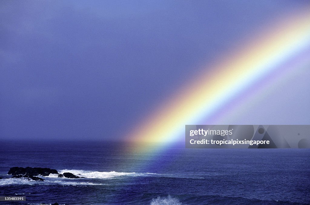 Rainbow over the pacific ocean near Oahu Hawaii USA