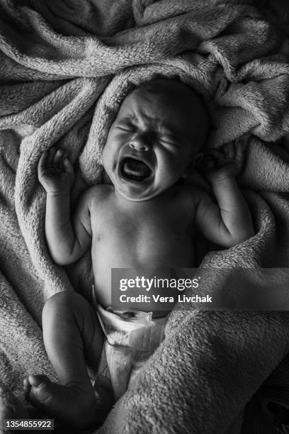sweet newborn crying baby - eyes crying stock-fotos und bilder