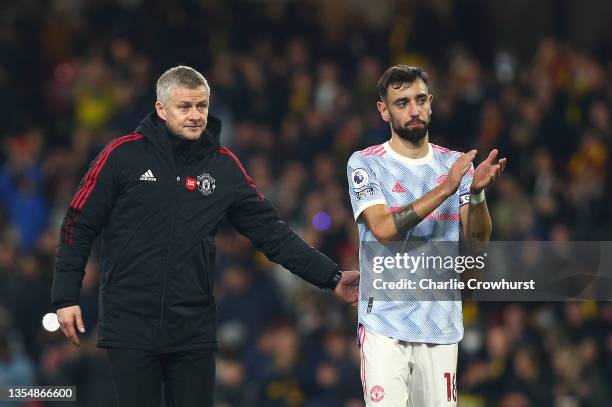 Ole Gunnar Solskjaer, Manager of Manchester United interacts with Bruno Fernandes of Manchester United following the Premier League match between...