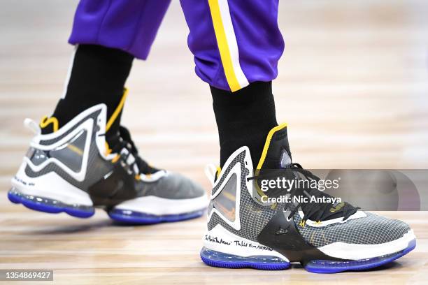 Detail of the sneakers worn by LeBron James of the Los Angeles Lakers before the game against the Detroit Pistons at Little Caesars Arena on November...